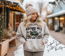Load image into Gallery viewer, RAISING HELL AND KIDS AINT EASY HOODIE/CREW SWEATSHIRT
